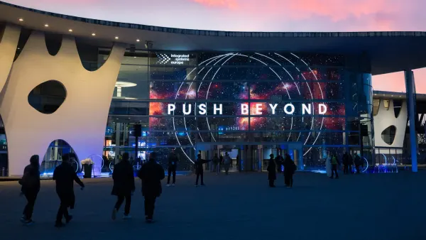 Facade of the Fira de Barcelona lit with the PUSH BEYOND theme during ISE 2026
