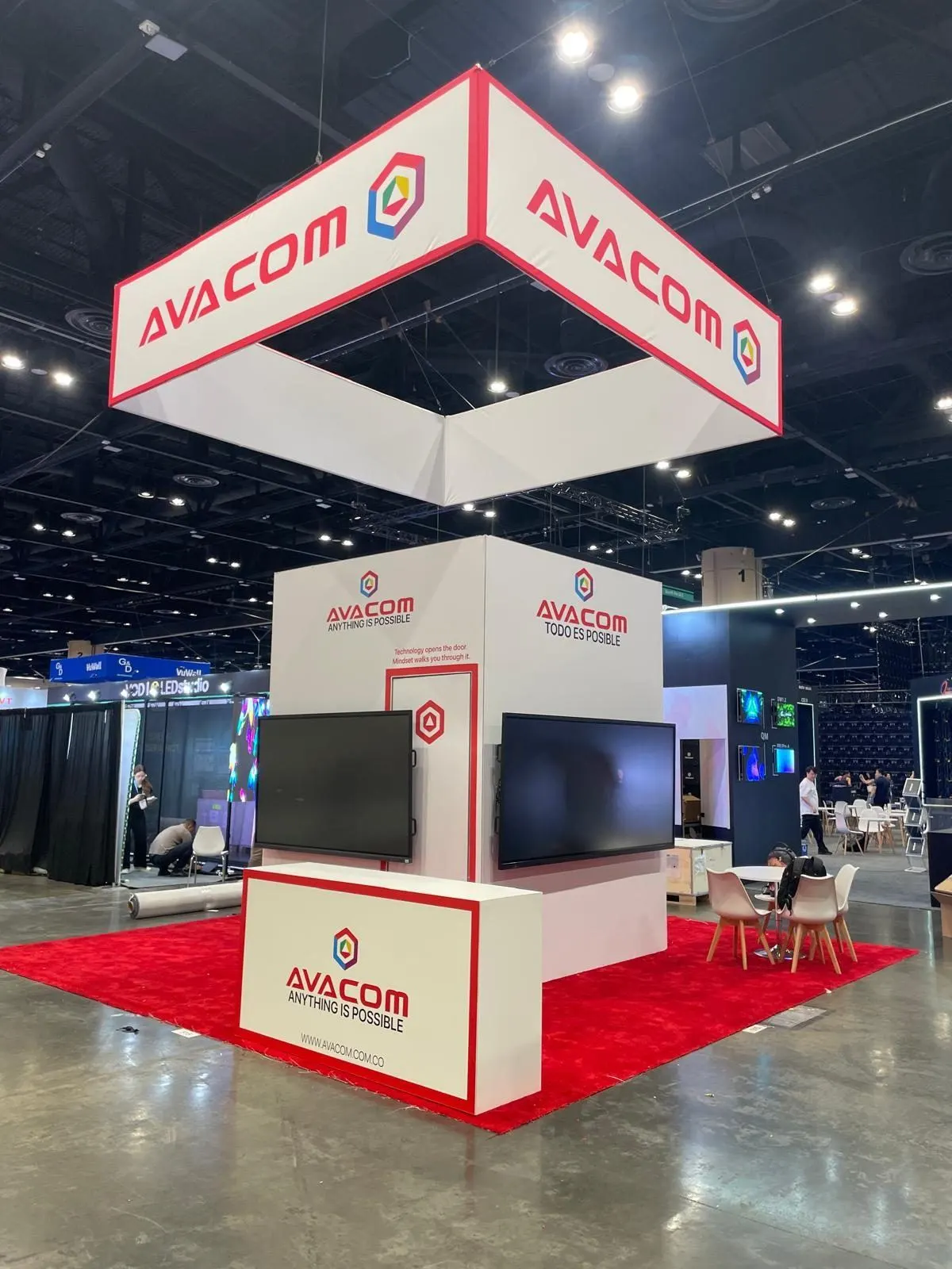 AVACOM booth at InfoComm 2025 Orlando with interactive displays for smart classrooms